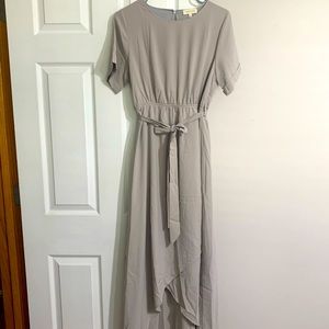 Brand new dress. Never worn. Nicely made. Gray/stone color.